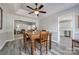 Dining room with hardwood floors, wooden table, and views to living room at 100 Sea Island Blvd, Fort Mill, SC 29708