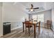 Spacious dining room with wood table and chairs, ceiling fan and hardwood floors at 100 Sea Island Blvd, Fort Mill, SC 29708