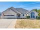 Ranch style home with attached garage and manicured lawn at 100 Sea Island Blvd, Fort Mill, SC 29708