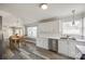 Bright kitchen with white cabinets, stainless steel appliances, and wood-look floors at 100 Sea Island Blvd, Fort Mill, SC 29708