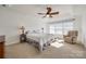 Spacious main bedroom with large windows, ceiling fan and neutral decor at 100 Sea Island Blvd, Fort Mill, SC 29708