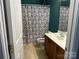 Bathroom with a shower/tub combo and wood vanity at 1004 Rosewater Ln, Indian Trail, NC 28079