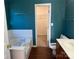 Teal-walled bathroom with a garden tub and double vanity at 1004 Rosewater Ln, Indian Trail, NC 28079