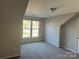 Spacious bedroom with large windows and neutral wall colors at 1004 Rosewater Ln, Indian Trail, NC 28079