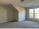 Bright bedroom featuring ample natural light and carpet flooring at 1004 Rosewater Ln, Indian Trail, NC 28079