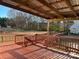 Spacious deck overlooks fenced backyard with mature trees at 1004 Rosewater Ln, Indian Trail, NC 28079