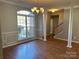 Bright dining room with hardwood floors and large window at 1004 Rosewater Ln, Indian Trail, NC 28079