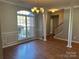 Bright dining room with hardwood floors and large window at 1004 Rosewater Ln, Indian Trail, NC 28079