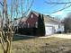 Brick house with attached garage and well-manicured lawn at 1004 Rosewater Ln, Indian Trail, NC 28079