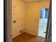 Laundry room with linoleum flooring and access to a small bathroom at 1004 Rosewater Ln, Indian Trail, NC 28079