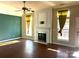 Living room featuring hardwood floors, fireplace and large windows at 1004 Rosewater Ln, Indian Trail, NC 28079