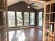 Sunroom with multiple windows, hardwood floors, and ceiling fan at 1004 Rosewater Ln, Indian Trail, NC 28079