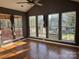 Sunroom with many windows and hardwood floors at 1004 Rosewater Ln, Indian Trail, NC 28079