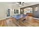 Basement recreation area with ping pong table and access to backyard at 10718 Lederer Ave, Charlotte, NC 28277