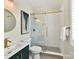 Bathroom with a glass shower, white subway tiles, and gold fixtures at 10718 Lederer Ave, Charlotte, NC 28277