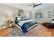 Spacious bedroom with teal bedding and hardwood floors at 10718 Lederer Ave, Charlotte, NC 28277