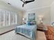 Bedroom with hardwood floors, window with shutters, and light blue bedding at 10718 Lederer Ave, Charlotte, NC 28277