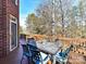 Deck with table and chairs, offering wooded views at 10718 Lederer Ave, Charlotte, NC 28277