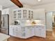 Kitchen with white cabinets, quartz countertops, and glass-front cabinets at 10718 Lederer Ave, Charlotte, NC 28277