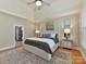 Main bedroom with high ceilings, hardwood floors, and ensuite bathroom at 10718 Lederer Ave, Charlotte, NC 28277