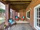 Brick patio with wicker furniture under the house at 10718 Lederer Ave, Charlotte, NC 28277