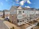 Two-story townhome with brick and siding exterior, offering a side view of the property at 11043 Lawyers Rd, Mint Hill, NC 28227