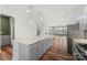 Modern kitchen with gray cabinets, granite counters, and stainless steel appliances at 11043 Lawyers Rd, Mint Hill, NC 28227