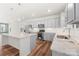 Modern kitchen with gray cabinets, granite countertops and island at 11043 Lawyers Rd, Mint Hill, NC 28227