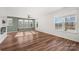 Bright living room with hardwood floors and large windows at 11043 Lawyers Rd, Mint Hill, NC 28227