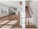 Open living space with hardwood floors and a view into the kitchen at 11043 Lawyers Rd, Mint Hill, NC 28227