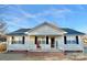 House with covered porch and rocking chair on front at 1105 Mount Olivet Rd, Kannapolis, NC 28083