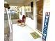 Welcoming front porch featuring a rocking chair and welcome mat at 1105 Mount Olivet Rd, Kannapolis, NC 28083