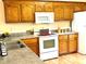 Bright kitchen with wood cabinets and modern appliances at 1105 Mount Olivet Rd, Kannapolis, NC 28083