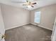 Well-lit bedroom with ceiling fan and neutral carpeting at 1107 Phifer Rd, Kings Mountain, NC 28086