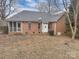 Back of house showing patio and screened porch at 1107 Phifer Rd, Kings Mountain, NC 28086