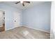 Bedroom features light blue walls and carpeting at 1112 Augustus Beamon Dr, Indian Trail, NC 28079