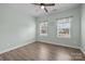 Bedroom with wood floor, light walls, and large window at 1112 Augustus Beamon Dr, Indian Trail, NC 28079