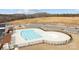 View of a large community pool with a zero entry, a nearby playground and parking at 1112 Augustus Beamon Dr, Indian Trail, NC 28079