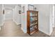 Charming hallway featuring a vintage display cabinet and light wood-look flooring at 1112 Augustus Beamon Dr, Indian Trail, NC 28079