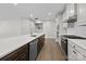 Kitchen featuring a large island with stainless steel dishwasher and white subway tile backsplash at 1112 Augustus Beamon Dr, Indian Trail, NC 28079