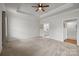 Spacious main bedroom features a trey ceiling, neutral walls, plush carpeting, and ensuite bath at 1112 Augustus Beamon Dr, Indian Trail, NC 28079