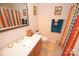 Clean bathroom with colorful shower curtain and vanity at 11646 Rabbit Ridge Rd, Charlotte, NC 28270