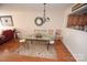 Formal dining room featuring hardwood floors and chandelier at 11646 Rabbit Ridge Rd, Charlotte, NC 28270