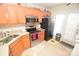 Kitchen with stainless steel appliances and wood cabinets at 11646 Rabbit Ridge Rd, Charlotte, NC 28270