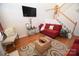 Living room with red couches, hardwood floors, and a view of the kitchen at 11646 Rabbit Ridge Rd, Charlotte, NC 28270