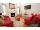 Living room features a fireplace, hardwood floors, and two red couches at 11646 Rabbit Ridge Rd, Charlotte, NC 28270