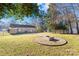 Large backyard with fire pit and wooden fence at 11816 Park Rd, Charlotte, NC 28226