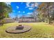 Spacious backyard with fire pit and large grassy area at 11816 Park Rd, Charlotte, NC 28226