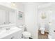 Simple bathroom with white vanity and toilet at 11816 Park Rd, Charlotte, NC 28226