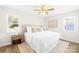 Spacious bedroom with ceiling fan and wood-look flooring at 11816 Park Rd, Charlotte, NC 28226